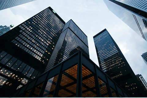 A view from the ground up of skyscrapers.