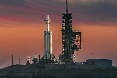 A rocket on its platform being prepared for launch.