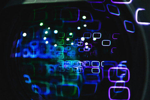 A series of different coloured, small neon shapes on a screen.